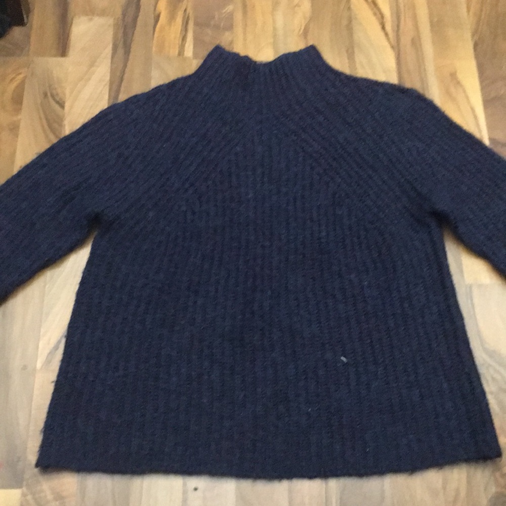 A dark blue and a purple sweater